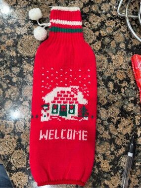 Festive Red 'Welcome' Holiday Knit Bottle Cover with Pom-Poms